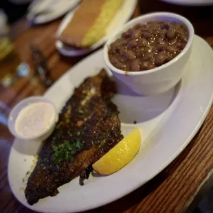 a plate of fish and beans