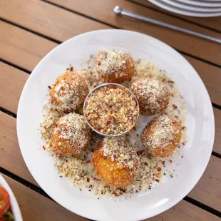 Arancini - Crispy Risotto Balls, Served with Pomodoro, Parmesan, Oregano, and Hot Chili