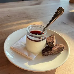 Italian Panna Cotta -  delicious creamy custard, served with Italian Amarena cherries and homemade biscotti.