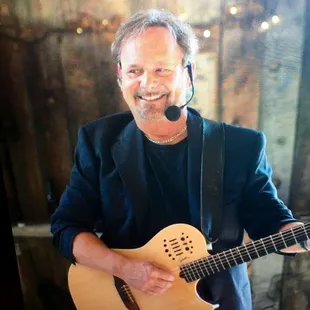 a man playing a guitar