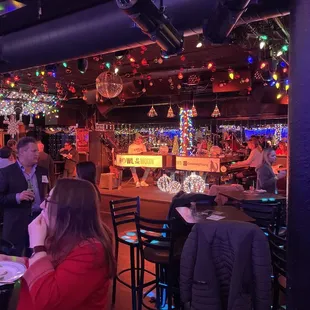 a crowd of people sitting at tables