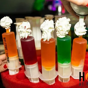 a person pouring liquid into a cake