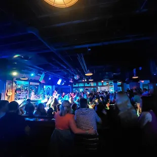 a crowd of people at a bar