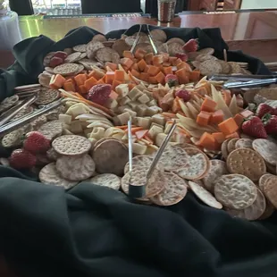 a platter of cheese and crackers