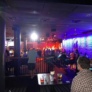 a crowd of people at a bar