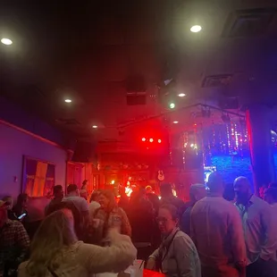 a crowd of people at a bar