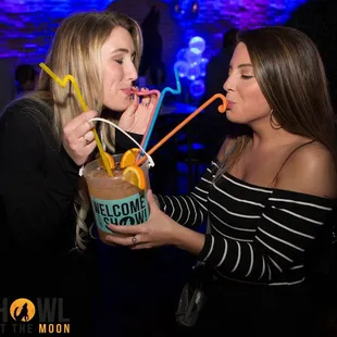 two women drinking cocktails