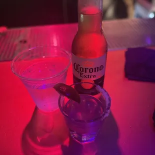 a bottle of beer and a shot glass