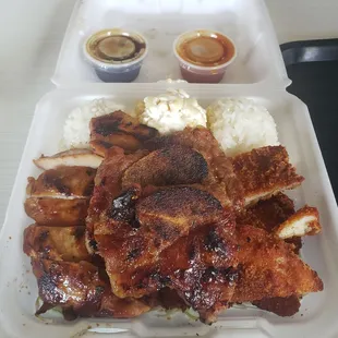 Short ribs, rice, macaroni salad, grilled chicken and fried chicken slices