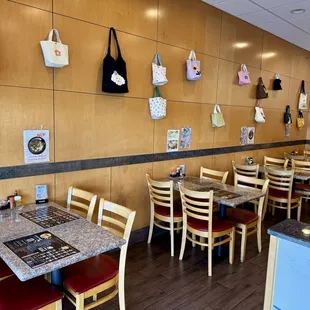 10.23.24 seating and all those cute tote bags as wall decor