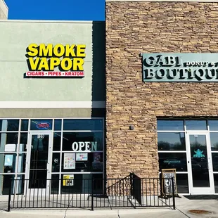 Exterior picture of Hp smoke vapor kratom shop next to gabi coffee donut shop