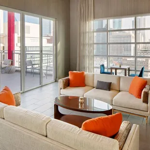 a living room with a view of the city