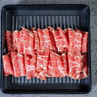 raw beef on a grill pan