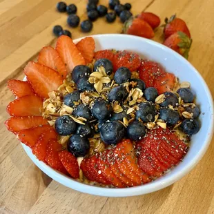 Greek yogurt, blueberries, strawberries, granola and chia seeds.