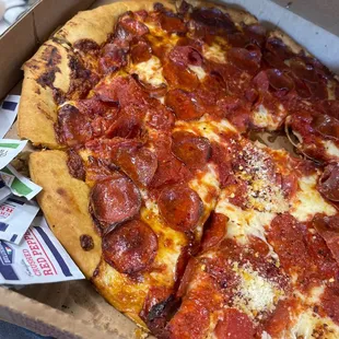 a pepperoni pizza in a box