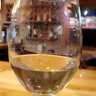 a glass of wine on a table