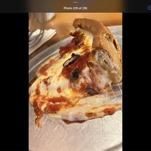 a slice of pizza on a plate