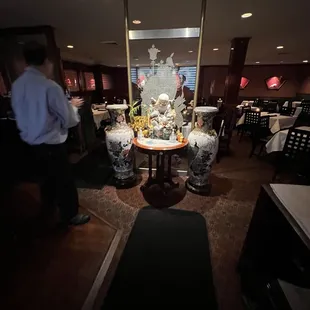 a man standing in a dimly lit restaurant