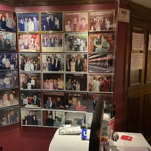 a wall full of family photos