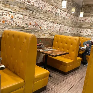 a man sitting at a table in a restaurant