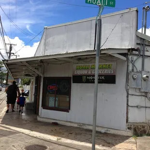 people walking in front of the store