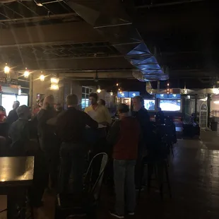 a crowd of people at a bar
