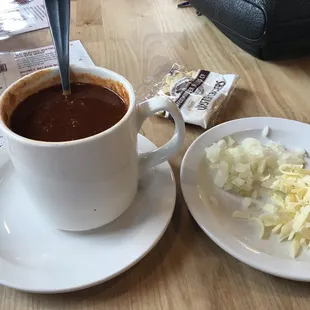Chili. Wanted to taste it plain before cheese and onion. Was good with out it but also was nice when I put it in