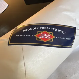 a sticker on a piece of cheese
