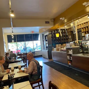 customers sitting at tables in a coffee shop