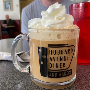 a cup of coffee with whipped cream