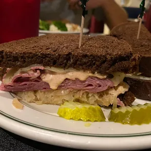a deli sandwich with pickles