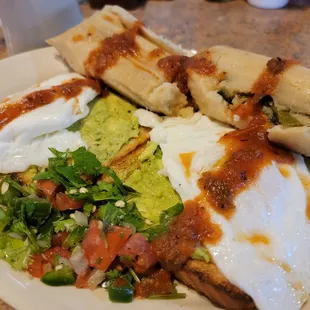 Close up: 2 Avocado Toasts, 2 eggs, 2 tamales!