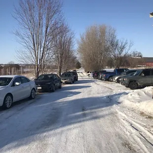 cars parked on a snowy road