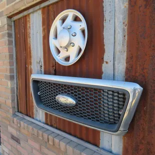 a close up of a hubcap grill grille