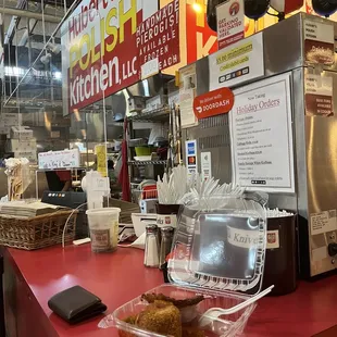 a counter with a tray of doughnuts