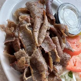 a plate of meat and vegetables