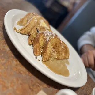 a plate of pancakes with syrup