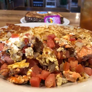 Salmon scramble with capers, onions, cream cheese and I added diced tomatoes. Served with hashbrowns and multigrain toast.