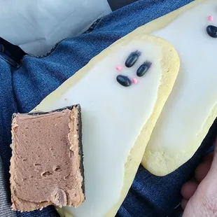 a person holding a piece of cake