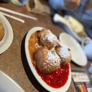 a plate of doughnuts and a cup of coffee