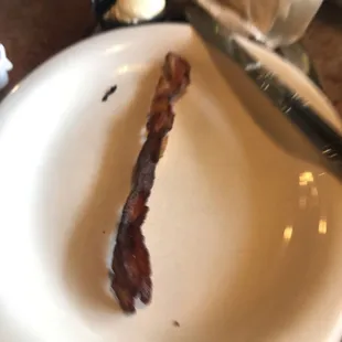 The bacon is burnt and not even crispy! Yuck!
