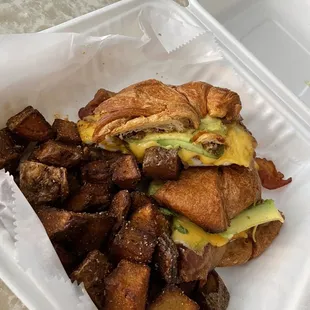 The snooze button breakfast sandwich on a croissant