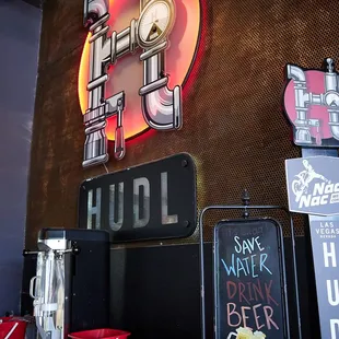 a neon sign with a clock