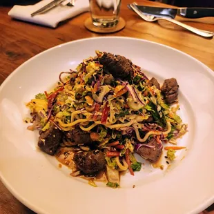 Thai Steak Salad* Pineapple Marinated Tenderloin, Mango, Peanuts, Lo Mein, Sesame Vinaigrette 22
