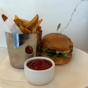 a burger and fries on a plate