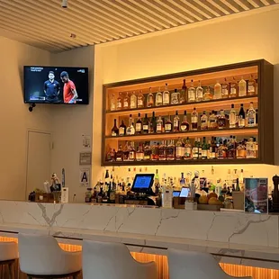 a bar with a television on the wall