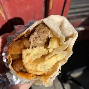 Vegan Breakfast Burrito w/ JustEgg, cheese, sausage, potatoes, &amp; avocado. Comes w/ salsa. Really good!!!