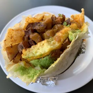Vegan Breakfast Burrito w/ JustEgg, vegan sausage, potatoes, vegan cheese, avocado, &amp; salsa. Delicious!