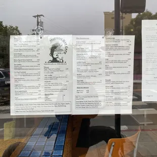Menu posted on window to look at while you're in line