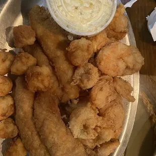 Large dinner plate with catfish, shrimp and scallops.